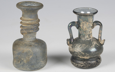 Two Roman style pottery oil lamps and two glass vases.