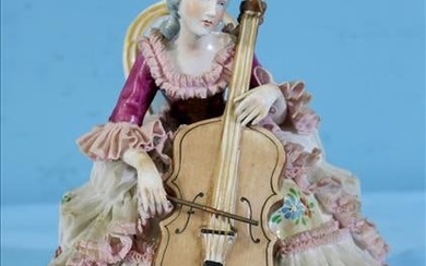 hand painted porcelain Dresden figure of lady playing cello