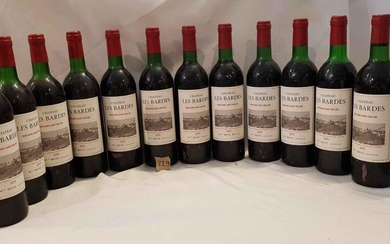 12 bottles château LES BARDES 1975 MONTAGNE SAINT EMILION. Beautiful label, 6 low neck and 5 high shoulder.