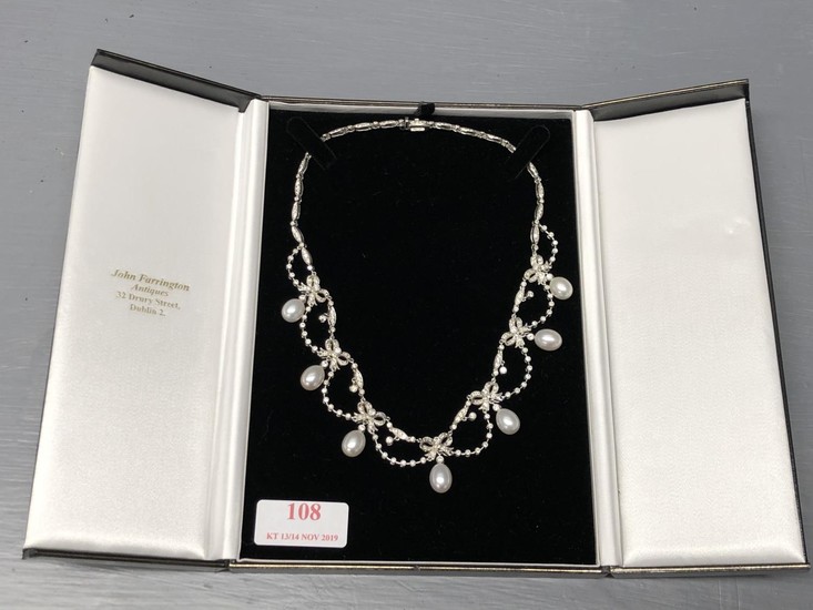 18ct White gold pearl & diamond necklace consisting of 7 ova...