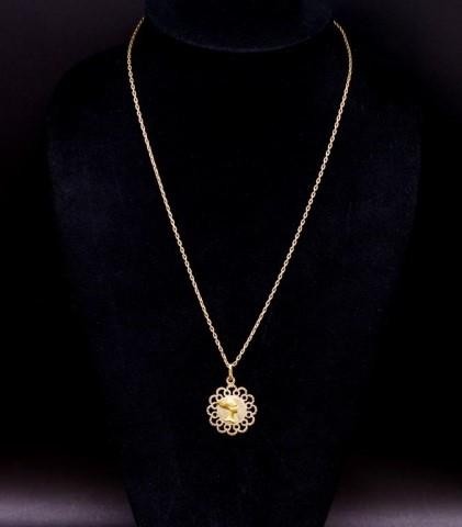 18ct yellow gold pendant and gold chain depicting Fortuna an...
