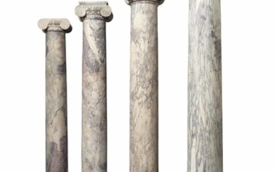 A SET OF FOUR ITALIAN VIOLET BRECCIA MARBLE COLUMNS, THE COLUMNS 17TH/18TH CENTURY, THE CAPITALS PROBABLY 16TH CENTURY