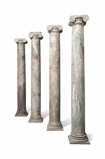 A SET OF FOUR ITALIAN VIOLET BRECCIA MARBLE COLUMNS, THE COLUMNS 17TH/18TH CENTURY, THE CAPITALS PROBABLY 16TH CENTURY