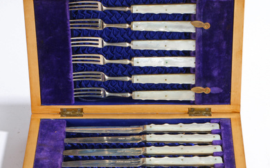 3383608. AN EDWARDIAN CASED SET OF SILVER AND MOTHER OF PEARL KNIVES AND FORKS.