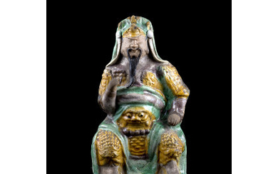 A 'three-colours' enamel biscuit model of the warrior Zhenwu (defects) China, Qing dynasty, Kangxi period (1662-1722) (h. 20 cm.)