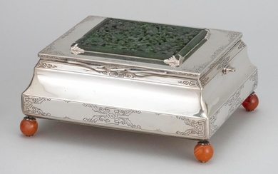EDWARD I. FARMER INC. STERLING SILVER, JADE AND CARNELIAN CIGARETTE BOX Hinged cover mounted with a pierced spinach jade plaque carv...