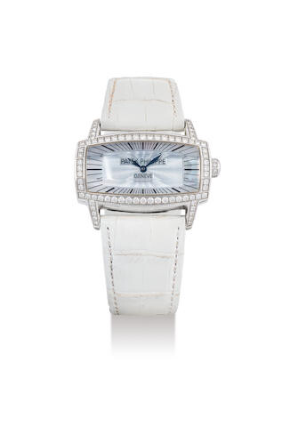 Patek Philippe. A lady's White Gold & Diamond-set Wristwatch With Mother-Of-Pearl Dial