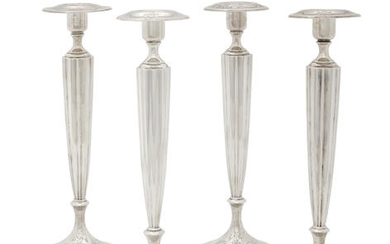 An American sterling silver set of four candlesticks