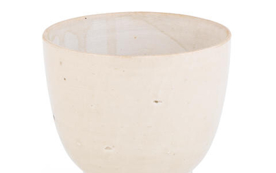 A white-glazed cup