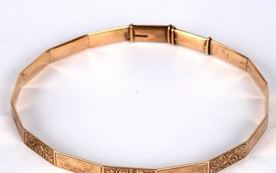 A 9ct gold arm bangle, of polygonal shape with