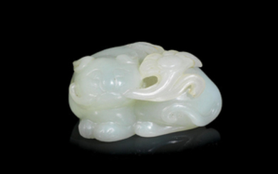 A pale green jade carving of a cat