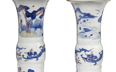 TWO UNDERGLAZE-BLUE AND COPPER-RED-DECORATED CELADON-GLAZED GU-FORM VASES, KANGXI PERIOD (1662-1722)