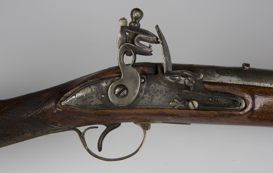A 10-bore Brown Bess flintlock musket, barrel length, 98.5cm, the lockplate marked for East India Co