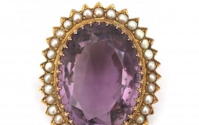A 14 karat gold amethyst and pearl brooch. An oval cut faceted amethyst in a surround of natural seed pearls. Gross weight: 15.6 g.