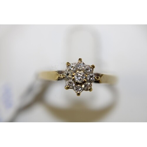 A 18ct gold diamond cluster ring size N
