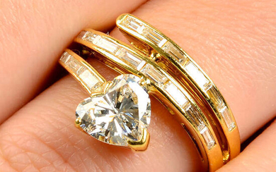 A 1970s 18ct gold stylised snake ring, with heart-shape diamond head and baguette-cut diamond scrolling band.