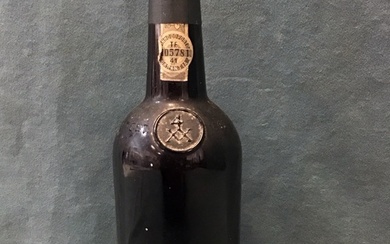 A 1985 bottle of Taylors vintage port, the seal numbered...