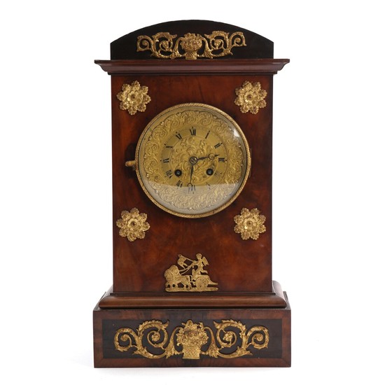 A 19th century Charles X mantel clock in a mahogany case. H. 39.5 cm.