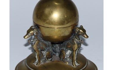 A 19th century brass inkwell, as a sphere supported by three...