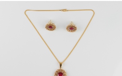 A 22ct gold, red stone and diamond cluster pendant necklace ...