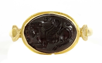 A Byzantine gentlemen's high carat gold cabochon garnet intaglio ring