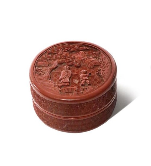 A CHINESE CINNABAR LACQUER CIRCULAR BOX AND COVER...
