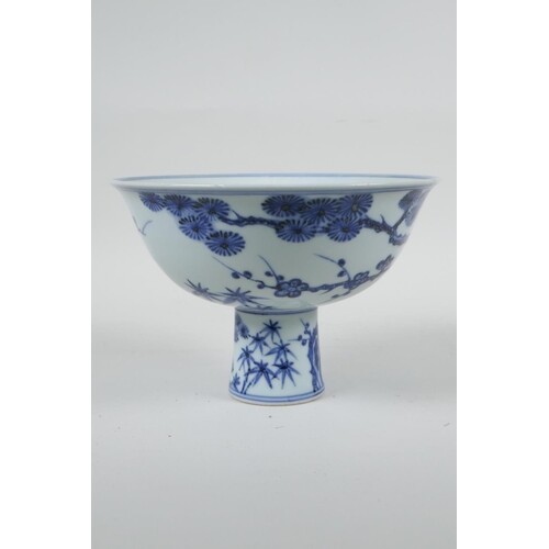 A Chinese blue and white porcelain stem bowl with cypress tr...