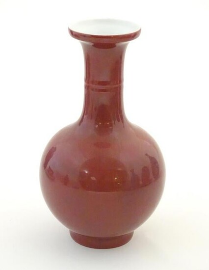 A Chinese bottle vase with a flared rim. Character