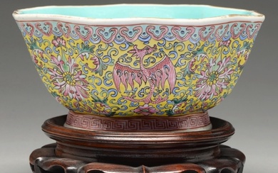 A Chinese yellow ground famille rose bowl, 20th c, enamelled...