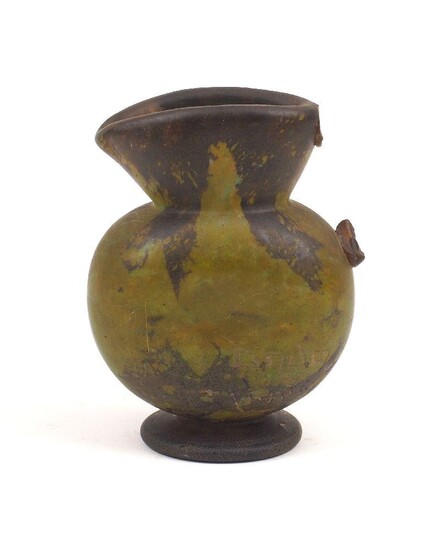 A Daum Nancy opaque green glass jug, lacking handle, inscribed Daum Nancy to the body, 9.2cm high
