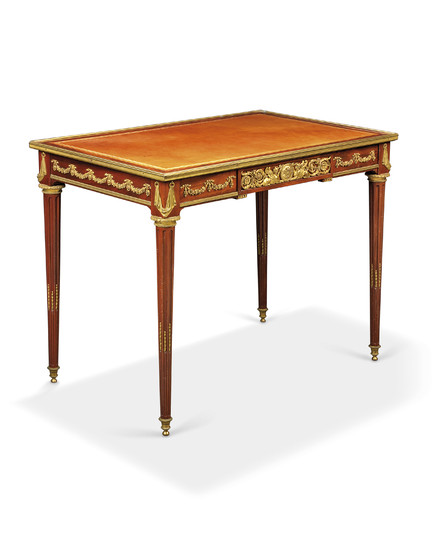 A FRENCH ORMOLU-MOUNTED MAHOGANY WRITING TABLE, IN THE MANNER OF JEAN-HENRI RIESENER, LATE 19TH CENTURY