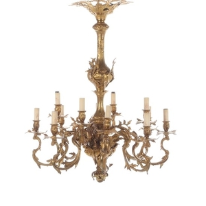 A French 19th century Rococo style gilt bronze 12-light chandelier. H. 95. Diam. 78 cm.