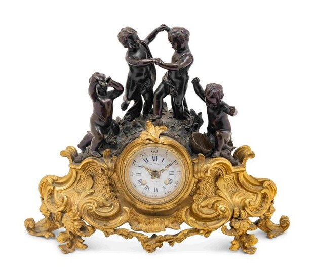 A French Gilt and Patinated Bronze Figural Mantel Clock