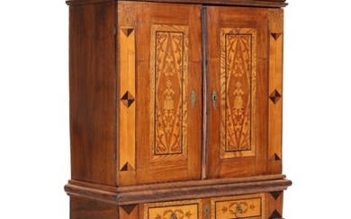 A Frisian oak and mahogany Baroque cabinet, front with drawer and two doors. Circa 1720. H. 232. W. 131. D. 61 cm.