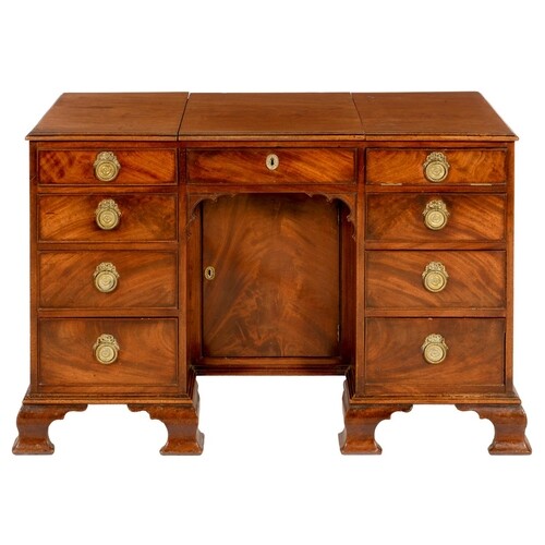 A GEORGE III MAHOGANY KNEEHOLE DRESSING TABLE the top with ...