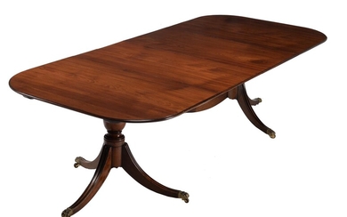 A George III mahogany twin pillar dining table