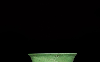 A Khotan green jade bowl and stand, Qing dynasty, 18th century | 清十八世紀 和闐青玉素撇口盃連菊瓣紋座
