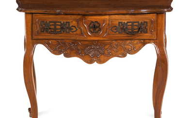A Louis XV Provincial Carved Walnut Table