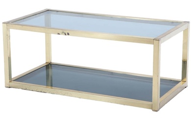 A MID CENTURY MODERN BRASS AND GLASS COFFEE TABLE.