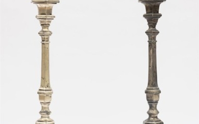 A PAIR OF ANTIQUE SILVERED BRONZE TORCHERES, 119CM HIGH.
