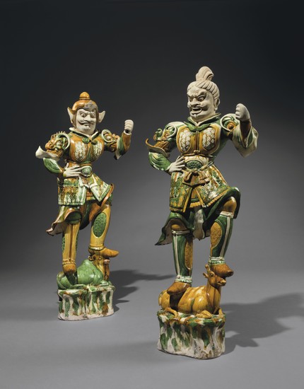 A PAIR OF MASSIVE SANCAI-GLAZED POTTERY GUARDIAN FIGURES, TANG DYNASTY (AD 618-907)