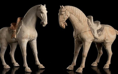 A PAIR OF PAINTED CERAMIC HORSES China, Tang dynasty