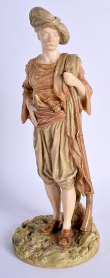 A ROYAL WORCESTER FIGURE OF A MALE BRINGAREE INDIAN