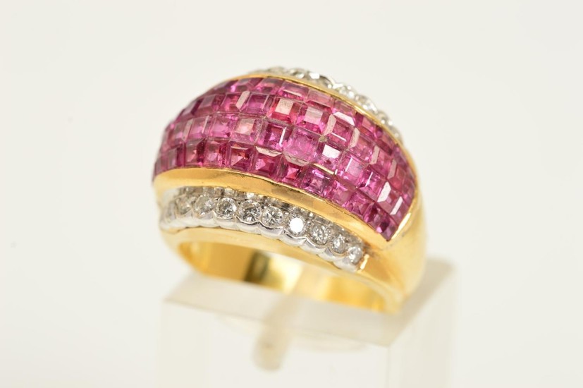 A RUBY AND DIAMOND DRESS RING, the central domed panel compr...