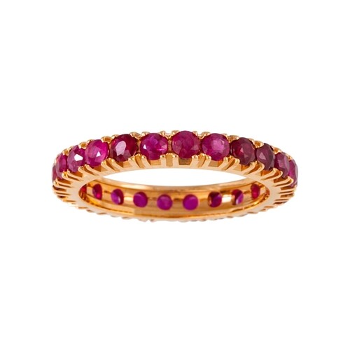 A RUBY FULL BANDED ETERNITY RING, the circular stones mounte...
