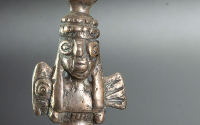 A Silver Miniature Figurine Representing a Standing Man Holding an Animal, Chimu Inca, Peru, 1470-1534 CE