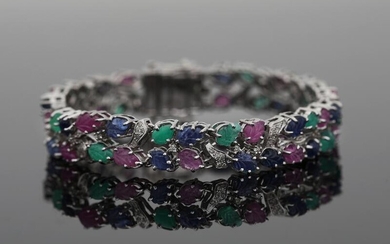 NOT SOLD. A "Tutti Frutti" bracelet set with numerous carved sapphires, emeralds and rubies and numerous diamonds, mounted in 14k white gold. L. app. 18.5 cm. – Bruun Rasmussen Auctioneers of Fine Art