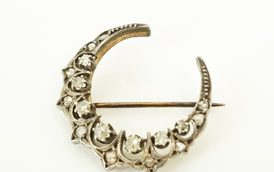 A VICTORIAN 14ct GOLD DIAMOND AND SILVER CRESCENT BROOCH