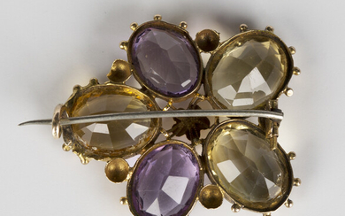 A Victorian gold, amethyst and citrine brooch, designed as a pansy flowerhead, mounted with five ova