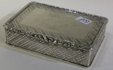 A Victorian silver snuff box with engine turned decoration.